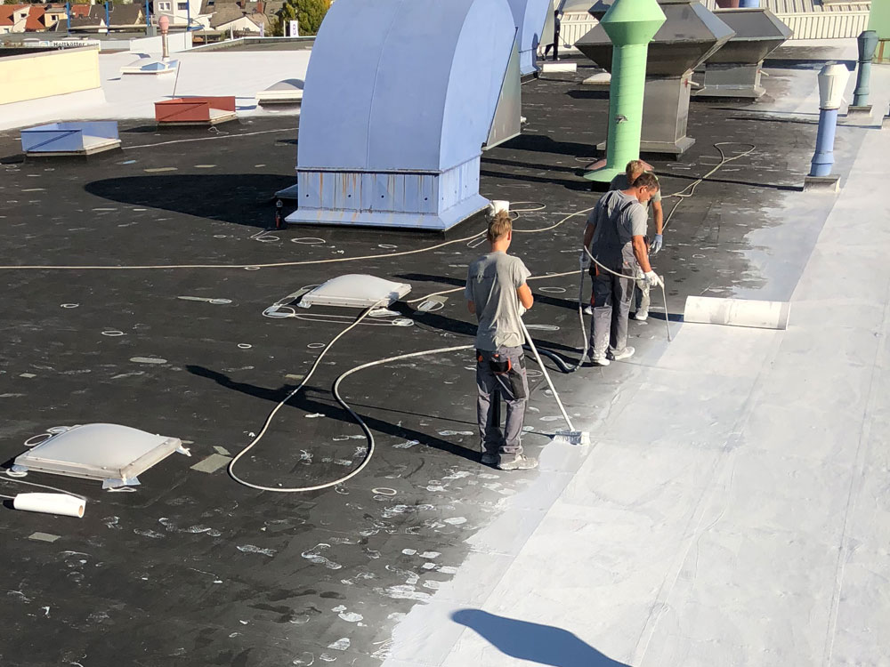 Flat roof renovation on industrial flat roof