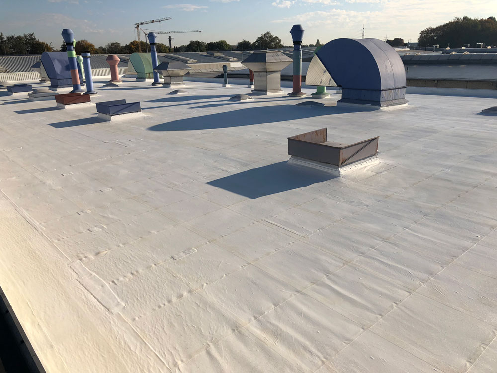 Flat roof renovation on industrial flat roof